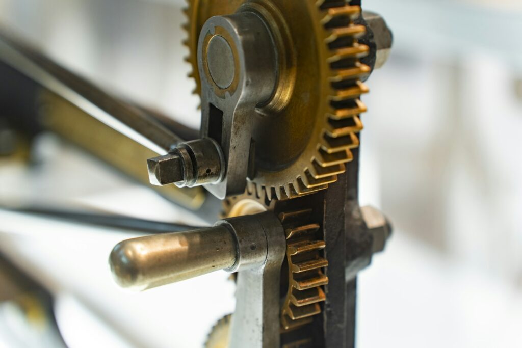 Interlocking metal gears showing the kind of mechanical parts that need wear-resistant coatings