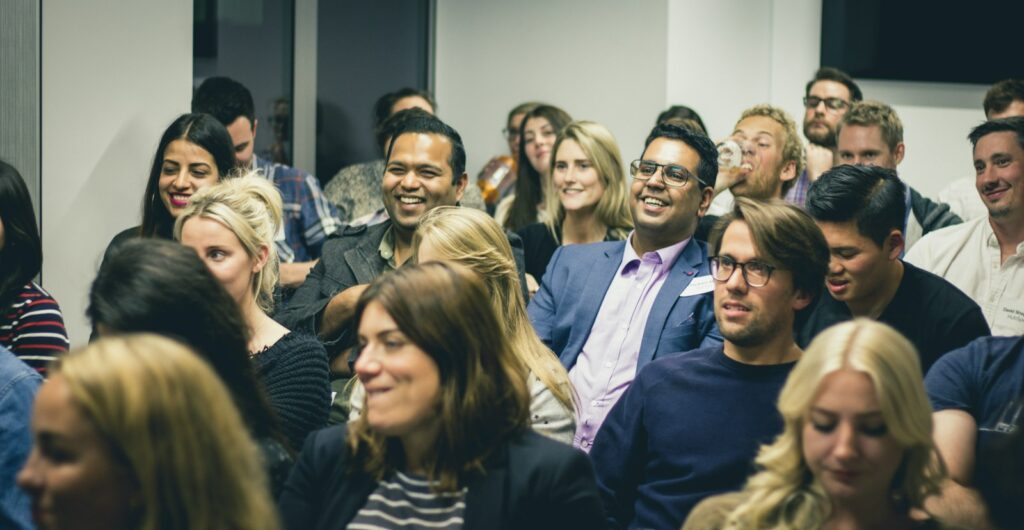 Group of adults listening attentively at a professional seminar or workshop event