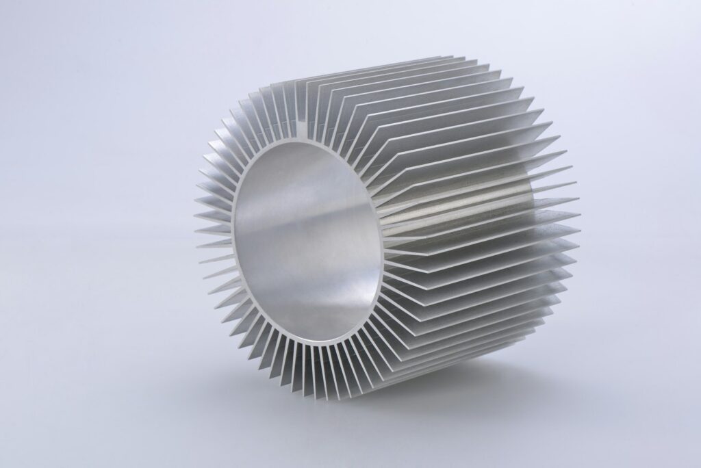 Silver aluminium extrusion profile on a white surface, a part suited to surface finishing